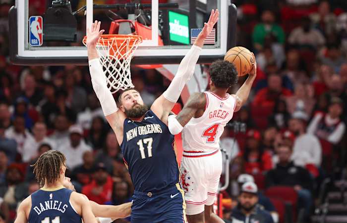 Pelicans center Jonas Valanciunas (17) defends as Houston Rockets guard Jalen Green (4) attempts to score during the second quarter at Toyota Center.